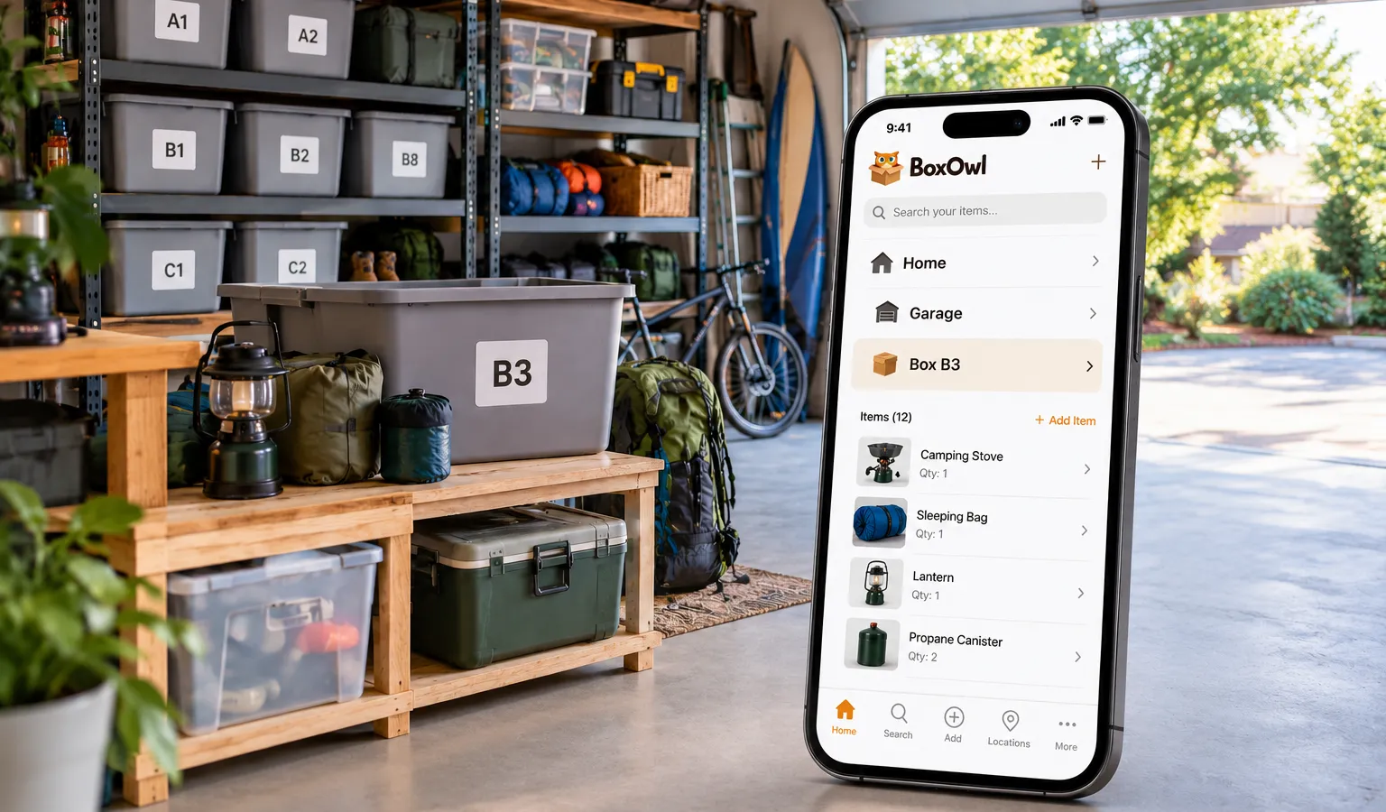 Organized garage with Box B3 and the BoxOwl app showing its stored camping gear
